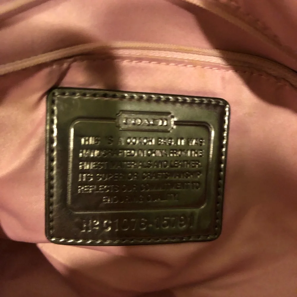Lavender Coach tote bag.